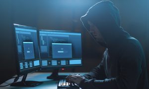 hacker planning ransomware attack on computer