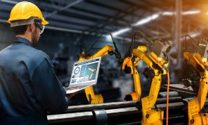 A worker relies on IoT protocols so his manufacturing equipment can communicate with his applications.