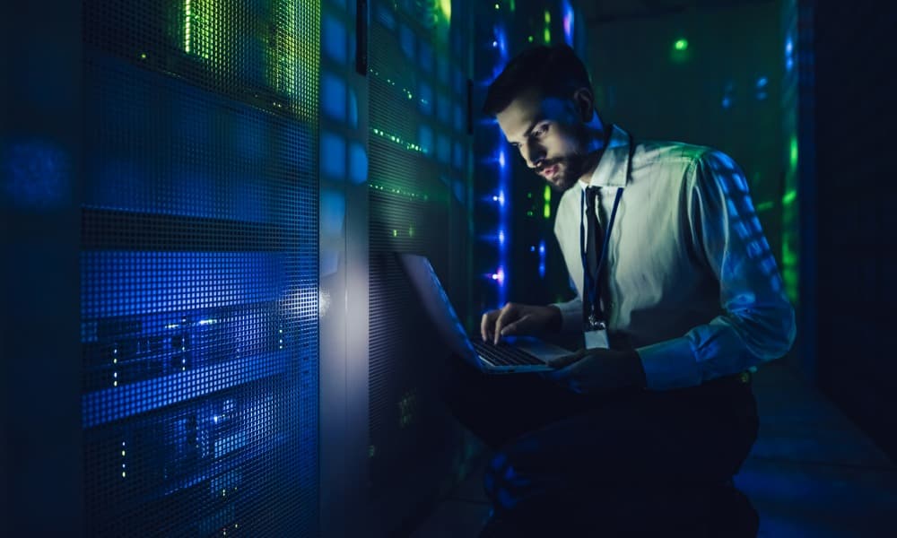 A technician checking cybersecurity hardware that is protecting offline files